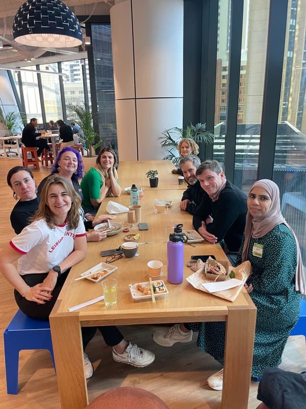 Members around a table at a coworking lunch