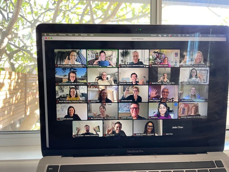 A Monday Yarn on Zoom, with members waving from a laptop